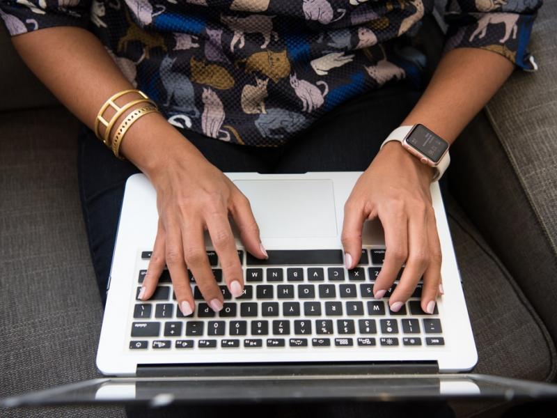 Woman typing on keyboard